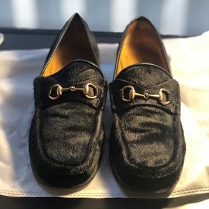 Women’s black Gucci loafers